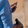 Student at MoD.Handgun.1 demonstrates "indexing" the magazine at an outdoor range.