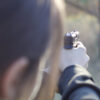 Student aims handgun with clear focus on the front sight, earning her Idaho Enhanced Concealed Weapons License