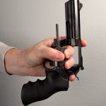 Holding a revolver using the "window" technique.
